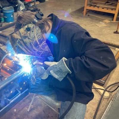 Blinn student John See IV experiencing the other side of the Ag Mechanics Project Show